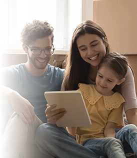 Family reviewing their moving plans on a tablet